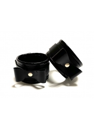 Черные наручники с бантиками из эко-кожи - БДСМ Арсенал - купить с доставкой во Владивостоке