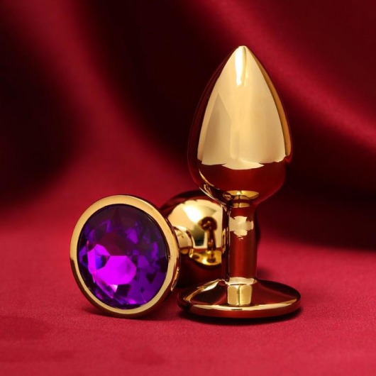 Золотистая анальная пробка с фиолетовым кристаллом - Сима-Ленд - купить с доставкой во Владивостоке